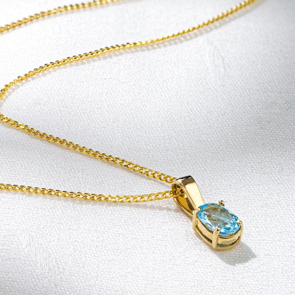 Blue Topaz 7 x 5mm 9K Yellow Gold Pendant Necklace - Image 4